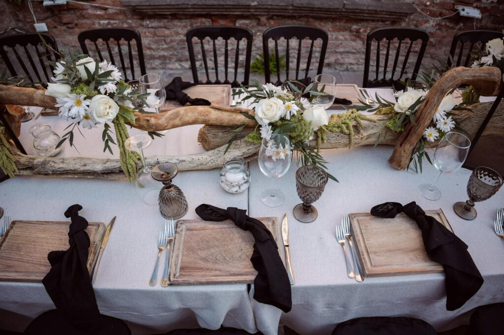 A DIY centerpiece made from driftwood and beach flowers. — beach wedding decor Las Vegas