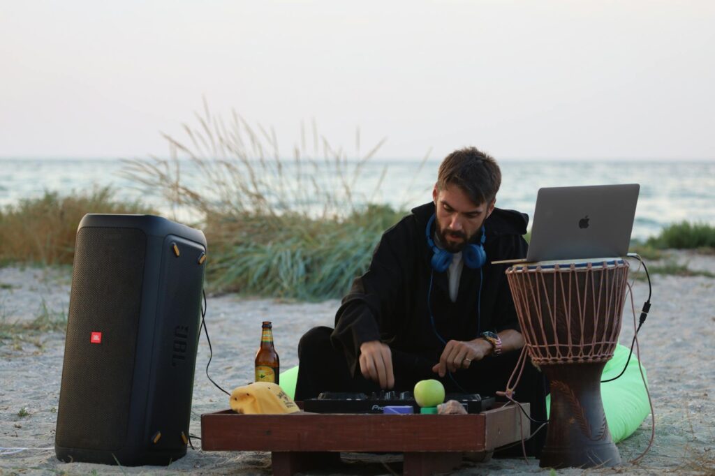 A DJ or musician playing music at a beach wedding reception. — beach wedding playlist Las Vegas