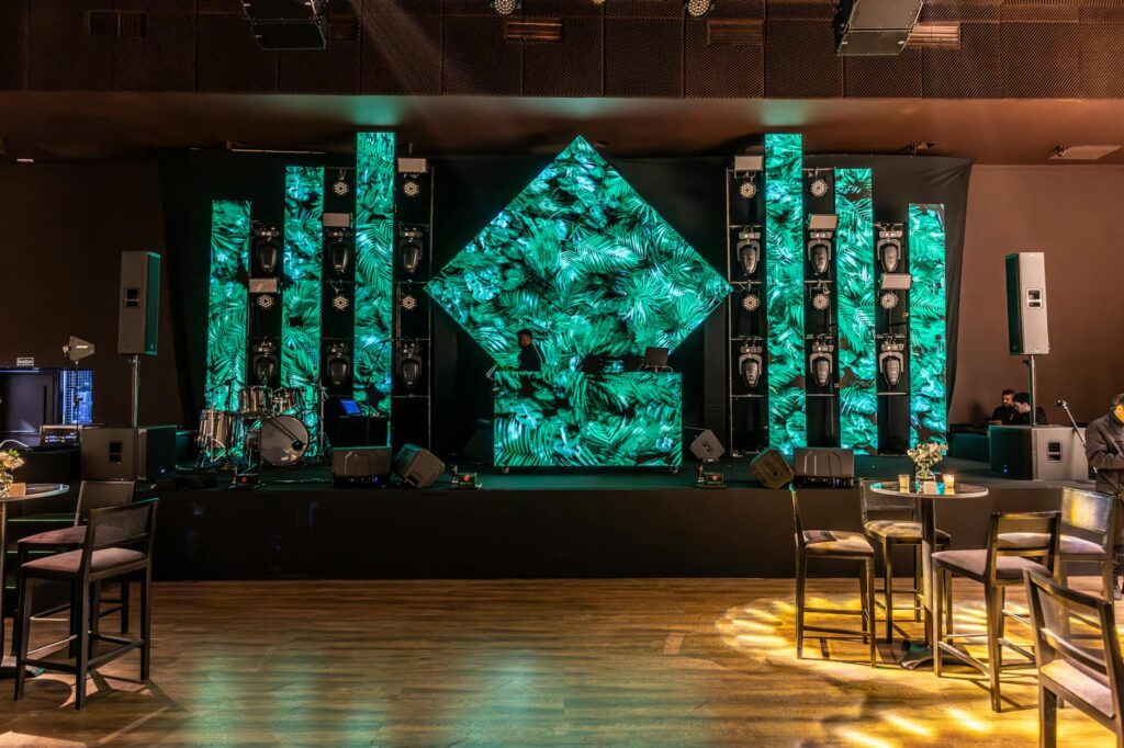 A DJ setup with casino-themed decorations, highlighting the vibrant atmosphere. — casino wedding music