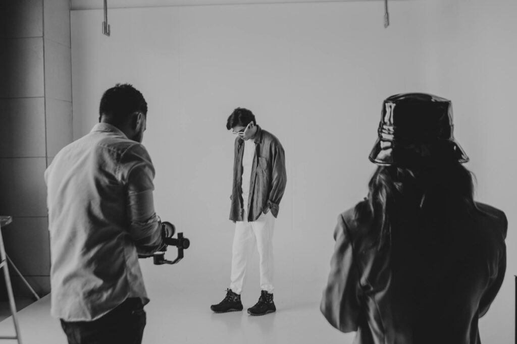 A behind-the-scenes photo of a wedding photographer directing a couple for a perfect shot. — wedding photographers Las V…