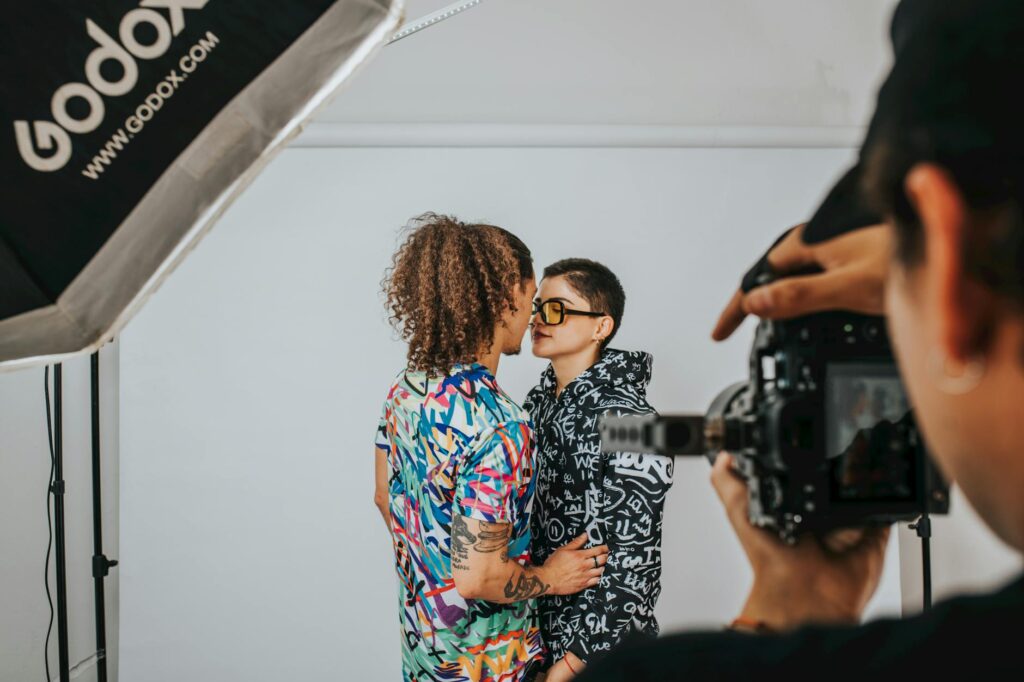 A behind-the-scenes shot of a photographer capturing a couple's first look. — best wedding photographers Las Vegas