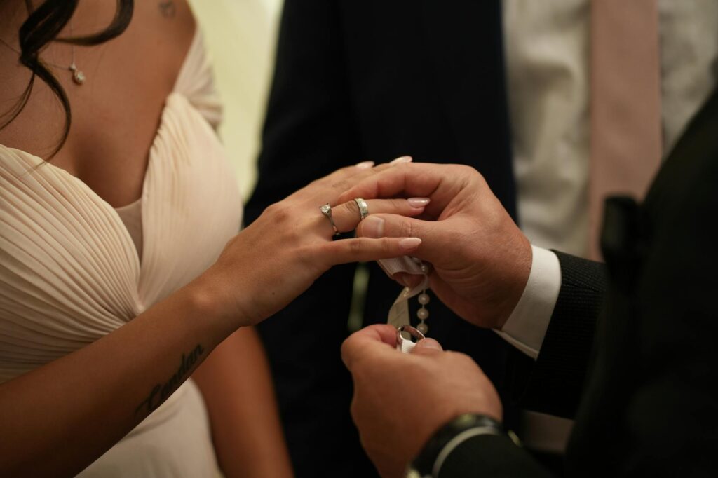 A candid shot of a couple exchanging vows in a unique Las Vegas location. — getting married in Las Vegas