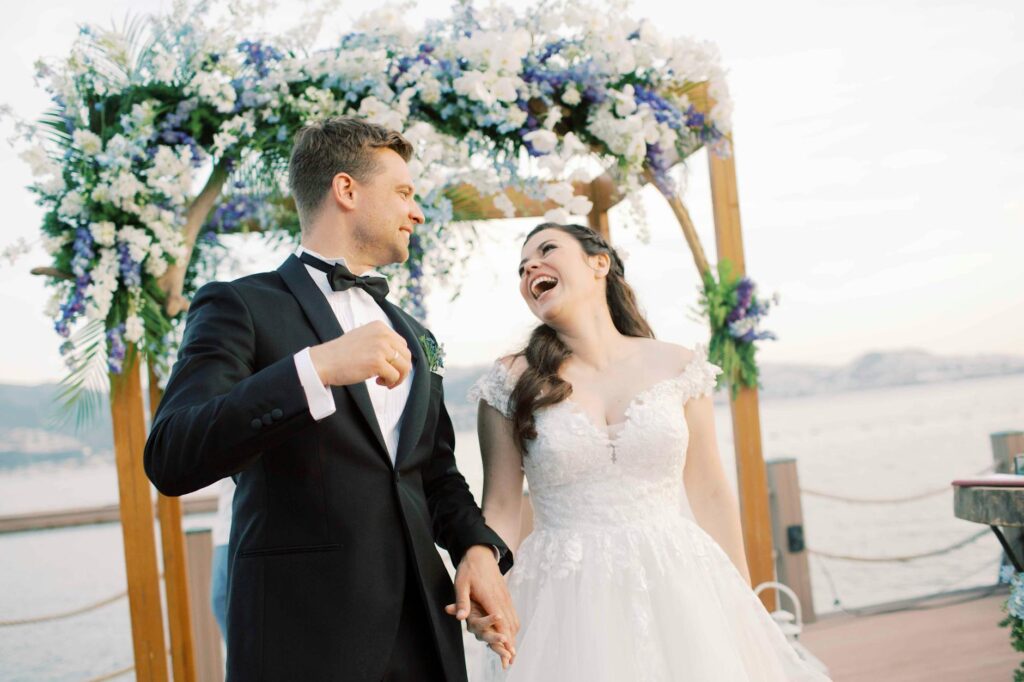 A candid shot of a couple laughing during their wedding ceremony with the Las Vegas Strip in the background. — best wedd…