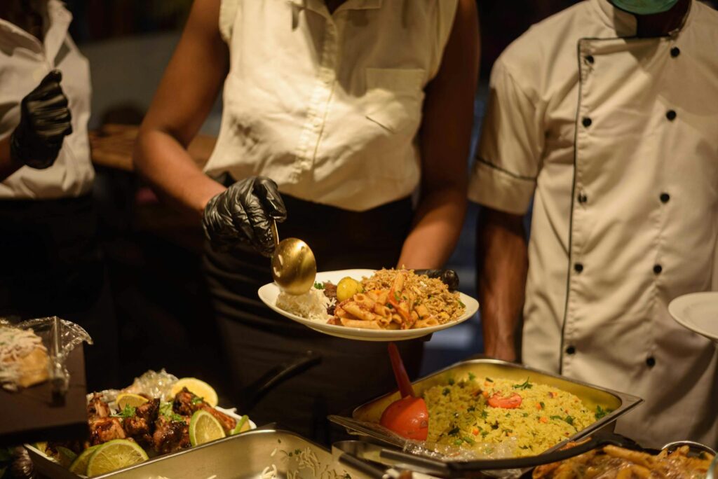 A chef preparing dishes at a beach wedding venue, emphasizing the catering process. — beach wedding catering Las Vegas