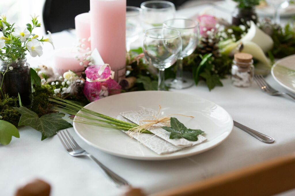 A close-up of a table set for a wedding reception featuring DIY decorations. — Las Vegas wedding budgeting