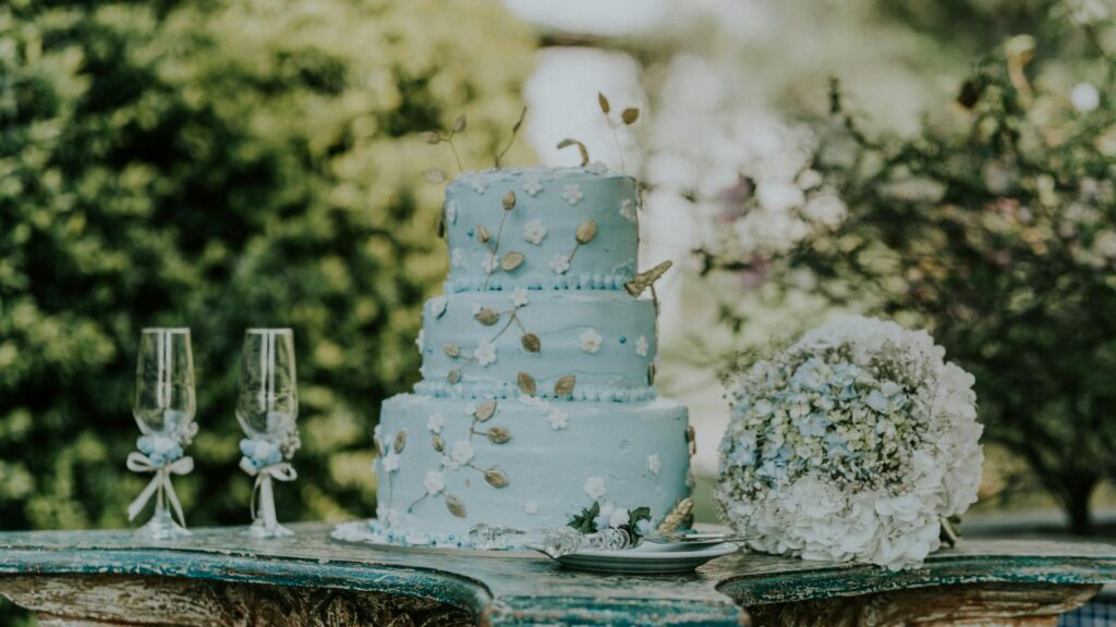 A close-up of a wedding cake designed with spring themes and decorations. — Las Vegas wedding trends 2026