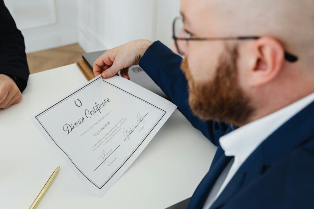A close-up of a wedding officiant holding a wedding certificate. — affordable wedding officiants Las Vegas