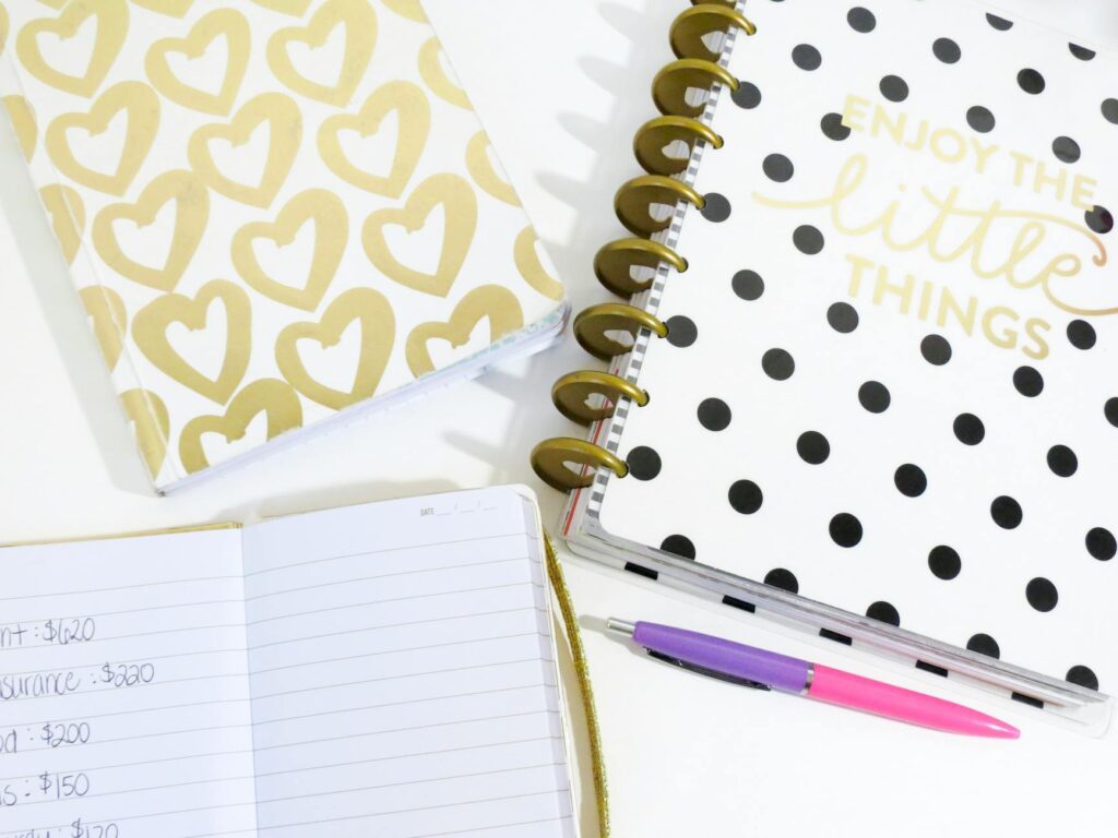 A close-up of a wedding planner's notebook with budget planning notes. — affordable wedding vendors Las Vegas