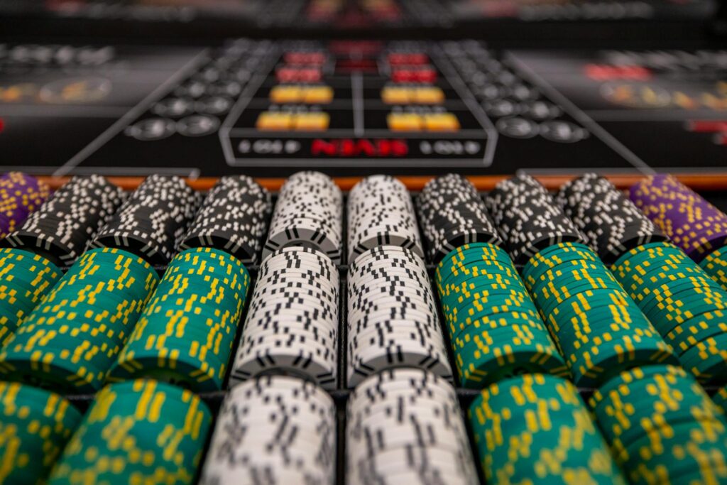 A close-up of a wedding ring set against the backdrop of casino chips. — casino wedding traditions Las Vegas