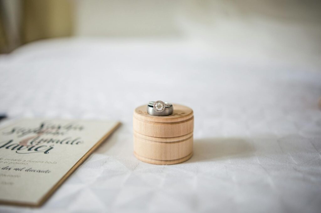 A close-up of wedding rings and invitations set against a beautiful Las Vegas backdrop. — wedding packages Las Vegas