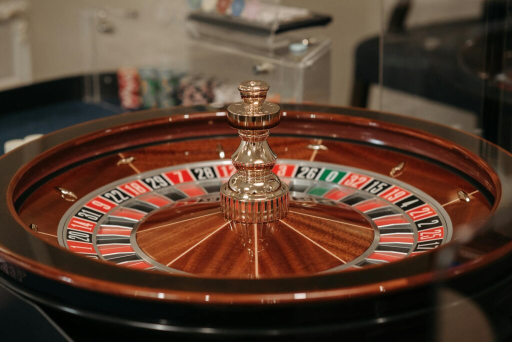 A close-up of wedding rings on a roulette table, symbolizing the gamble of wedding planning. — casino wedding planning m…