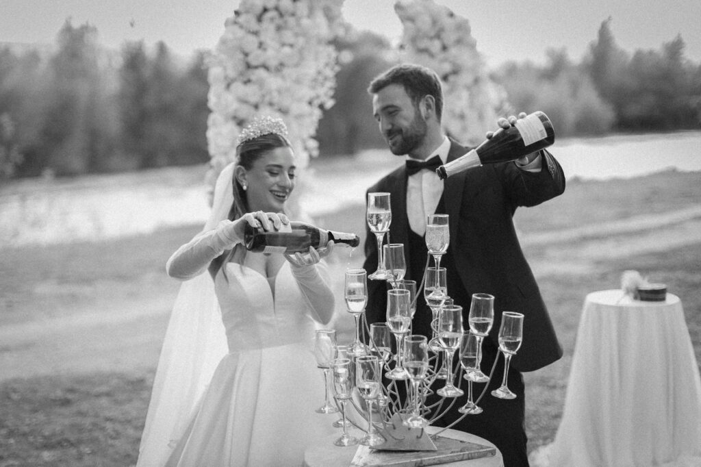 A couple celebrating with a champagne toast after their Las Vegas elopement. — luxurious elopement Las Vegas