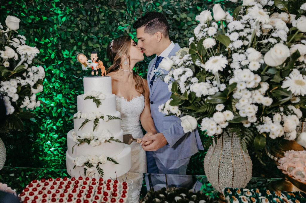 A couple cutting their casino wedding cake, highlighting personalized elements. — casino wedding cake trends