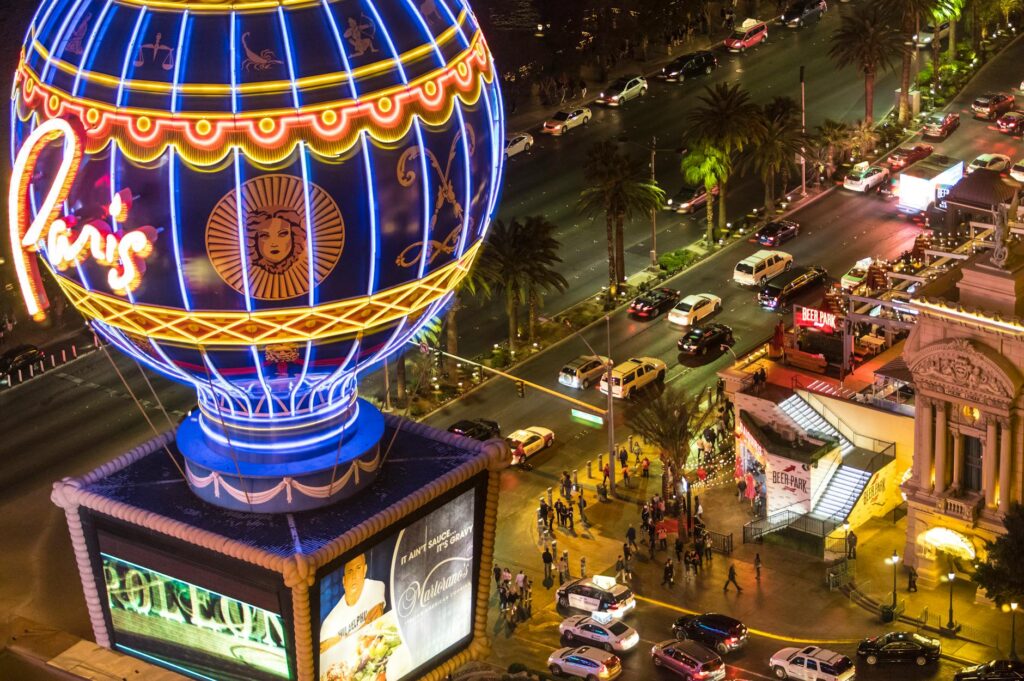 A couple enjoying a fun activity on the Las Vegas Strip after their wedding ceremony, highlighting the unique experiences …