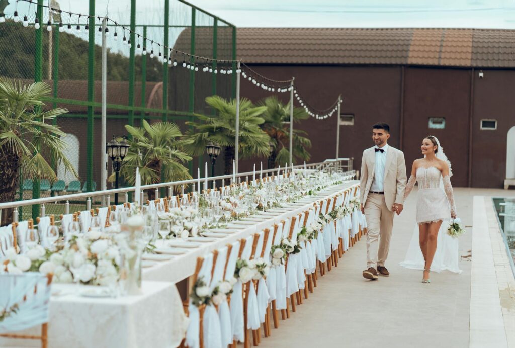 A couple exploring different wedding venues in Las Vegas, showcasing seasonal decorations and settings. — best time to g…