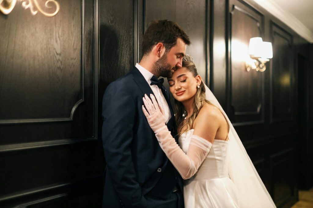 A couple happily planning their Las Vegas wedding with a wedding insurance brochure on the table. — Las Vegas wedding in…