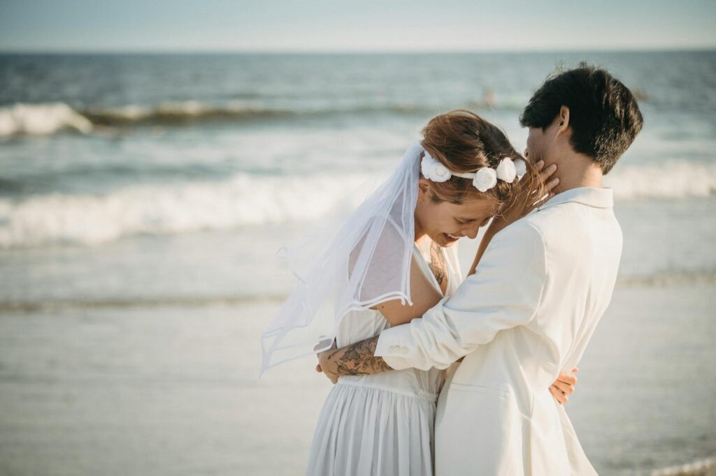 A couple sharing a special moment during their beach wedding ceremony. — beach wedding ceremony ideas Las Vegas