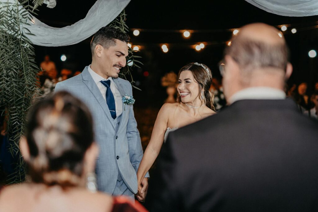 A couple smiling during a sunset elopement ceremony in Las Vegas. — affordable elopement packages Vegas