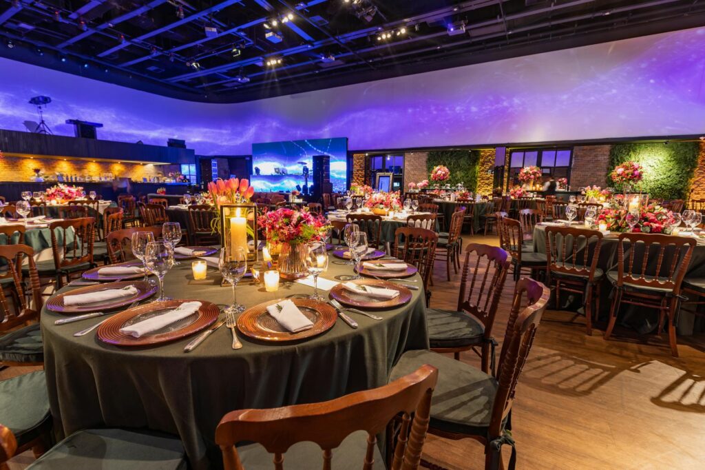 A festive reception at The Smith Center, decorated with elegant lighting and table settings. — affordable wedding venues…