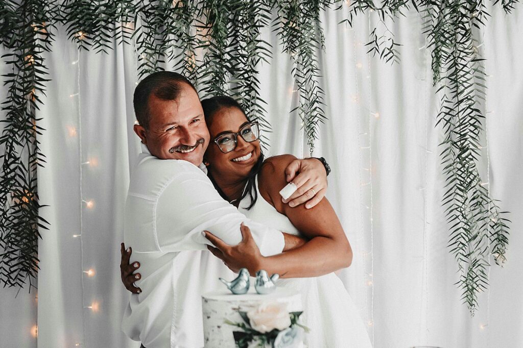 A happy couple celebrating their wedding day with a planner by their side. — Las Vegas wedding planner