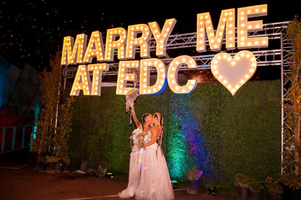 A joyful couple celebrating after their elopement with the Las Vegas Strip in the background. — elopement planning Las V…