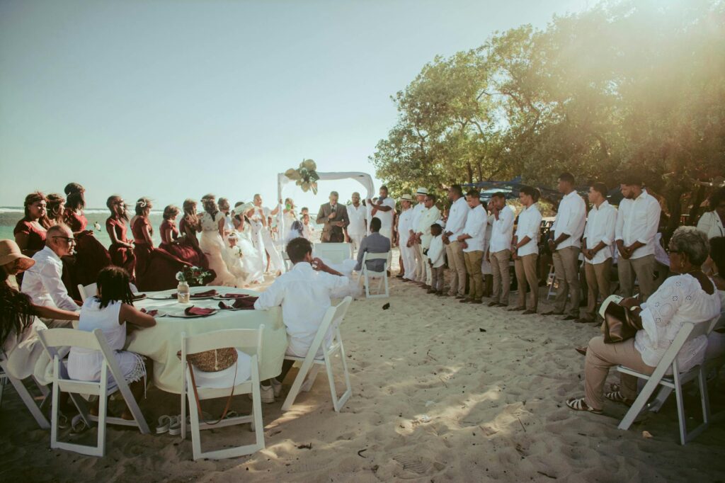 A joyful group of guests enjoying a beach wedding celebration. — beach wedding checklist Las Vegas