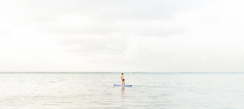 A paddleboarding session with wedding guests on the water. — beach wedding activities Las Vegas