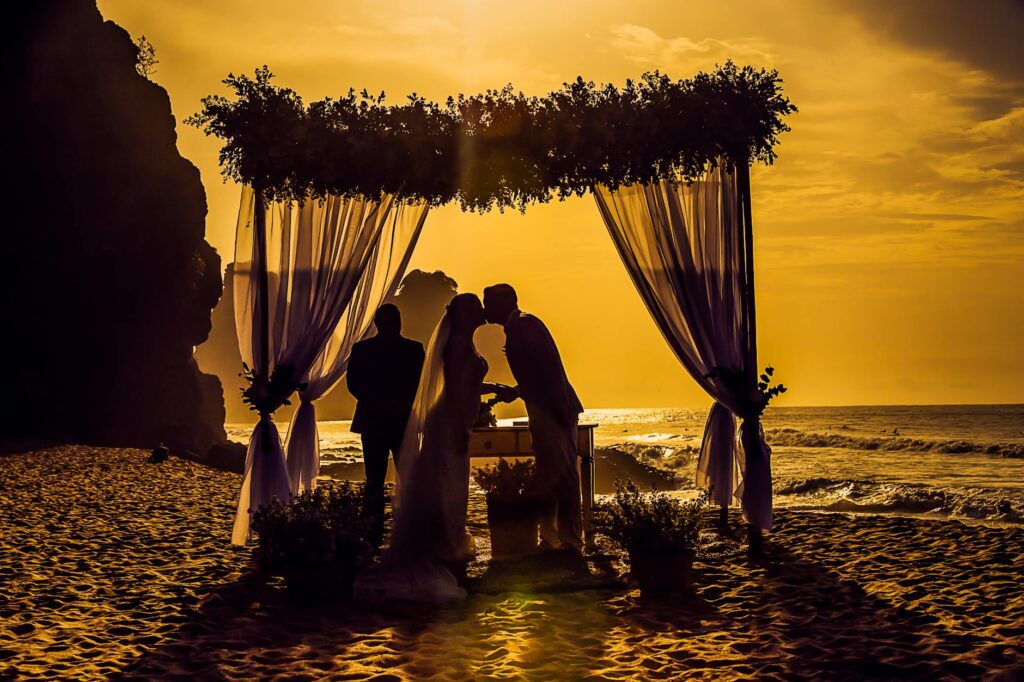 A stunning beach setup for a wedding ceremony at sunset. — beach wedding ceremony ideas Las Vegas