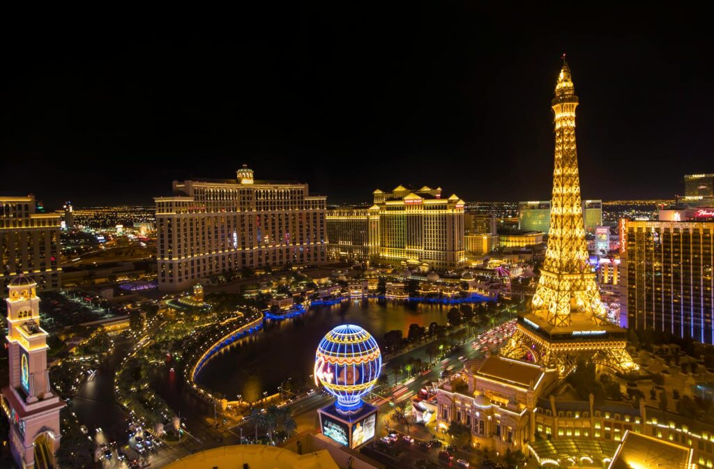 A summer wedding ceremony at sunset with the Las Vegas Strip in the background. — best time to get married Las Vegas