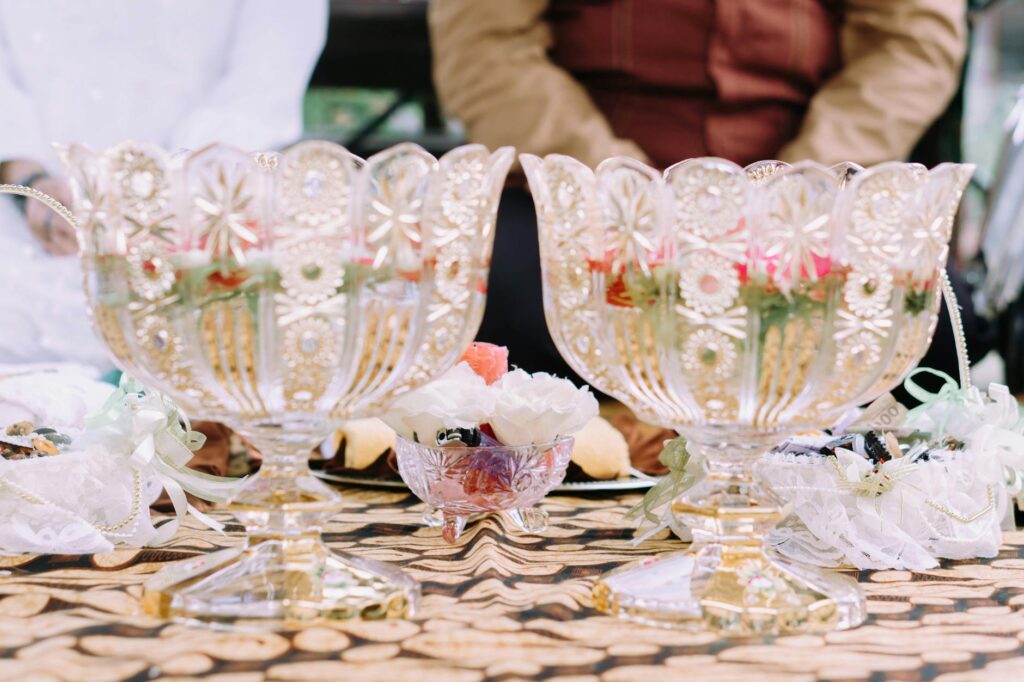 A table set up with budget wedding decor ideas, showcasing handmade items. — DIY wedding decor Vegas