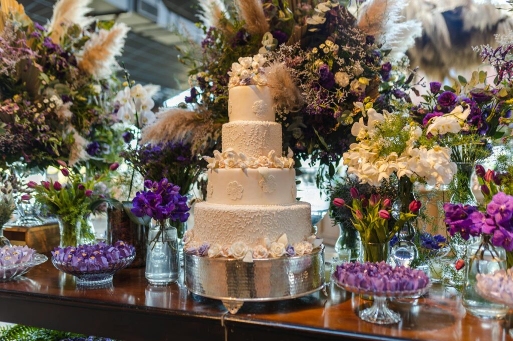 A table setting with a beautifully presented wedding cake and casino-themed decor. — casino wedding cake trends