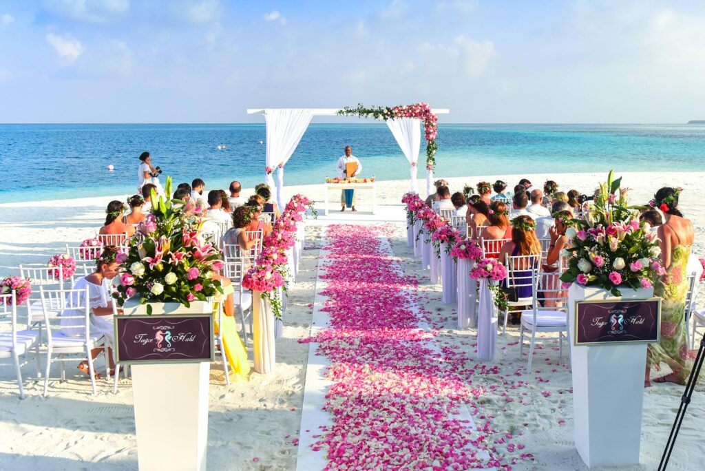 A vibrant beach wedding setup with guests enjoying activities. — beach wedding activities Las Vegas
