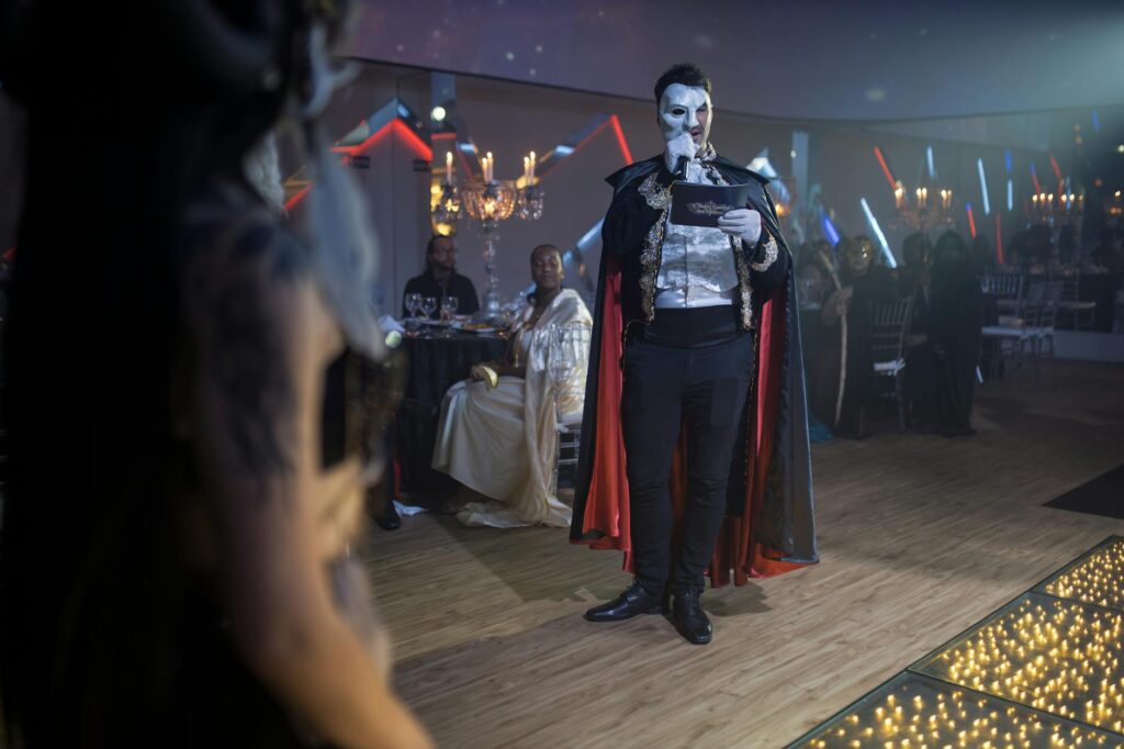 A vibrant masquerade ball wedding with guests in elegant masks. — unique wedding themes Las Vegas