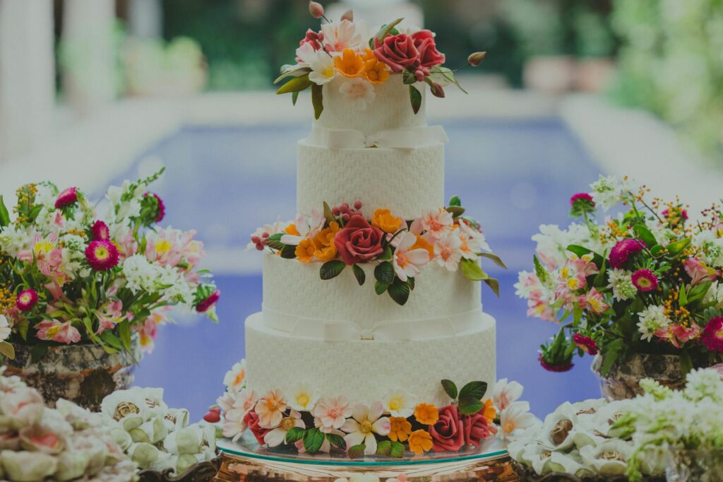 A vibrant wedding cake designed with a casino motif. — casino wedding themes Las Vegas