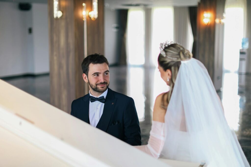 A wedding planner discussing details with a couple at a Las Vegas venue. — Las Vegas wedding planning checklist