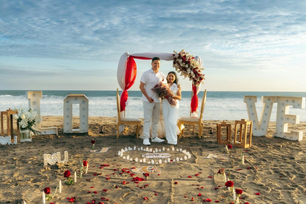 A wedding planner discussing details with a couple at a beach venue. — beach wedding checklist Las Vegas