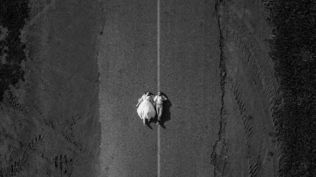 An artistic composition showing a photographer using a drone for aerial wedding shots. — wedding photographers Las Vegas