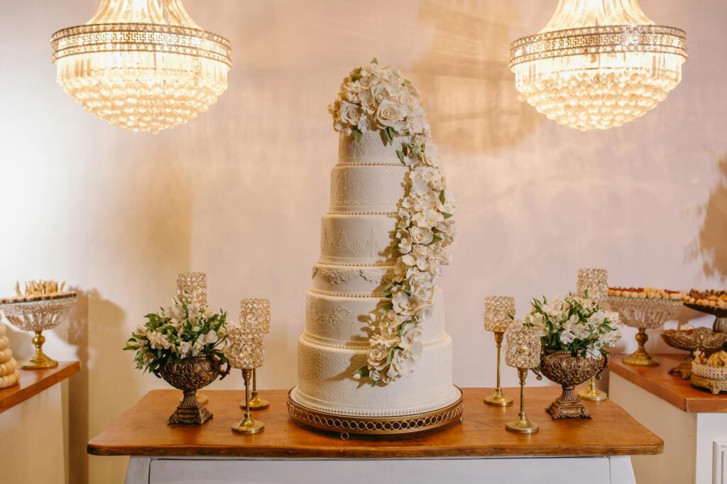 An elegant cake display at a Las Vegas wedding, showcasing various cake design trends. — casino wedding cake trends
