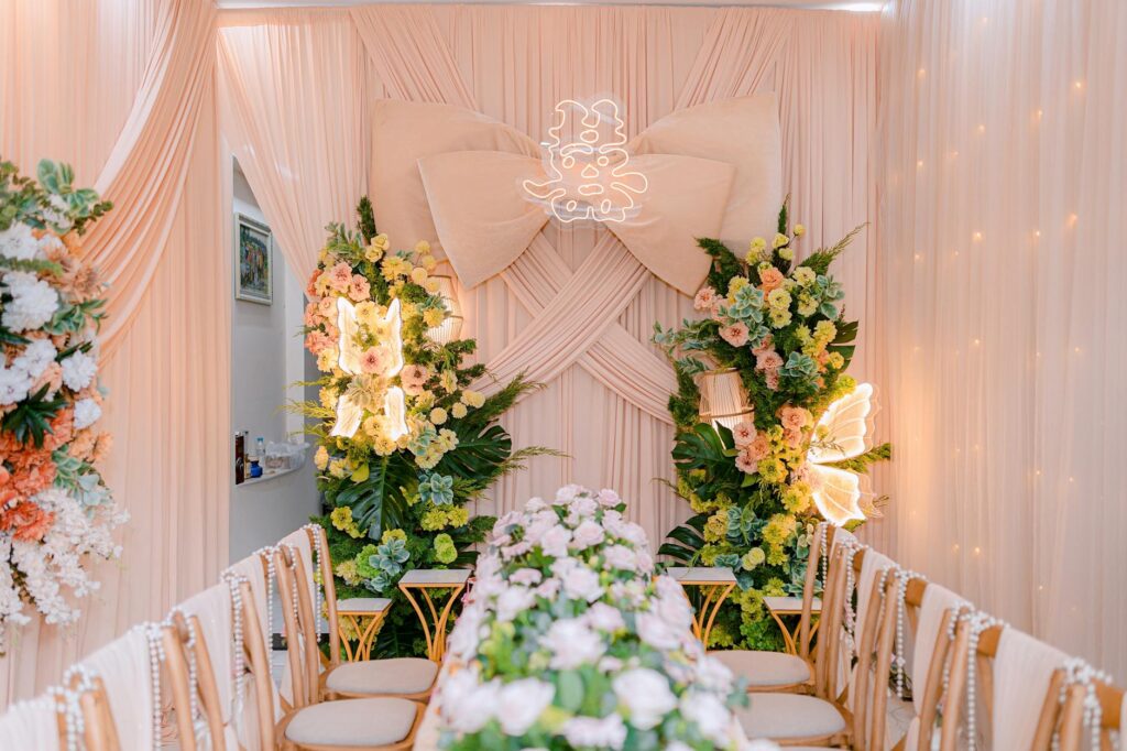 An elegant indoor wedding setup with beautiful floral arrangements and the photographer capturing the moment. — best wed…