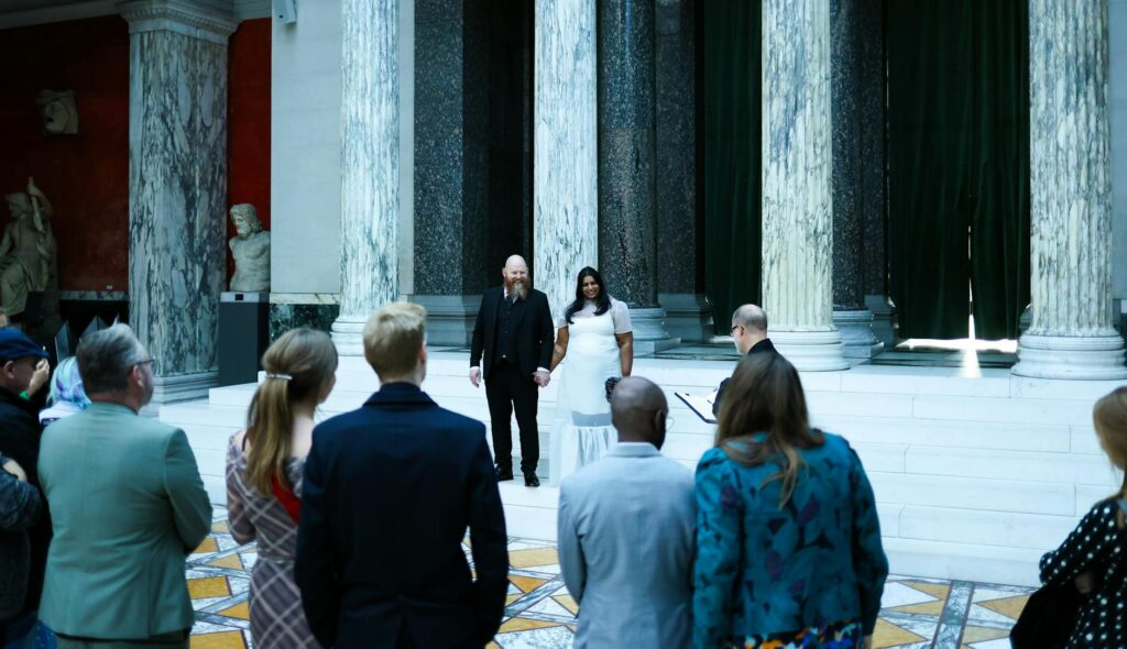 An elegant wedding ceremony inside The Mob Museum, with guests enjoying the unique historical backdrop. — unique wedding…