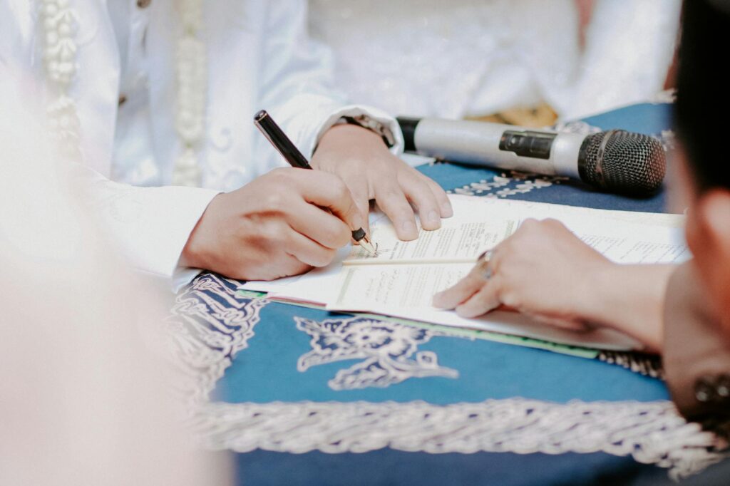 An officiant conducting a wedding on the beach, illustrating the legal aspect of Las Vegas beach wedding legal requirements.