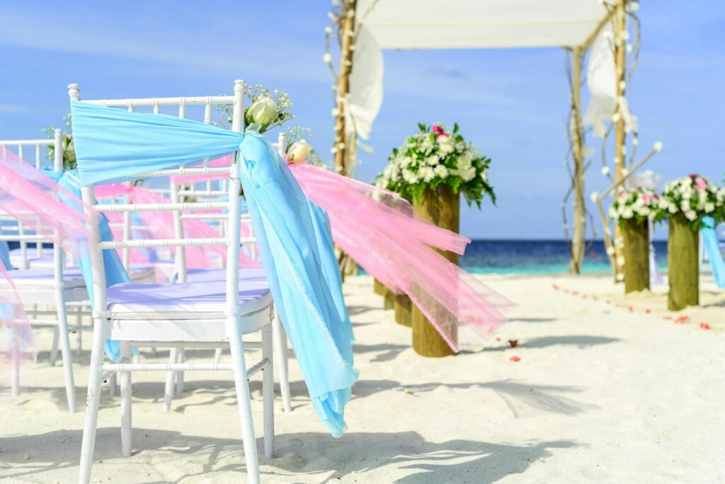 An outdoor beach wedding setup showcasing invitation decor — beach wedding invitation Las Vegas