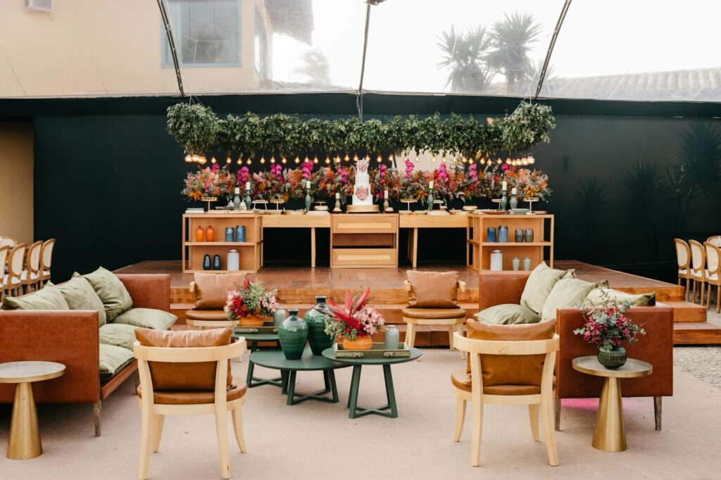 An outdoor reception area with vibrant lights and lounge seating — casino wedding after-party ideas