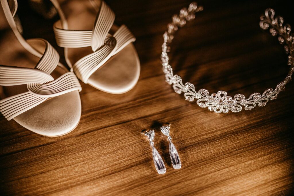 Close-up of elegant wedding accessories, including jewelry and shoes suitable for a casino wedding. — casino wedding dre…