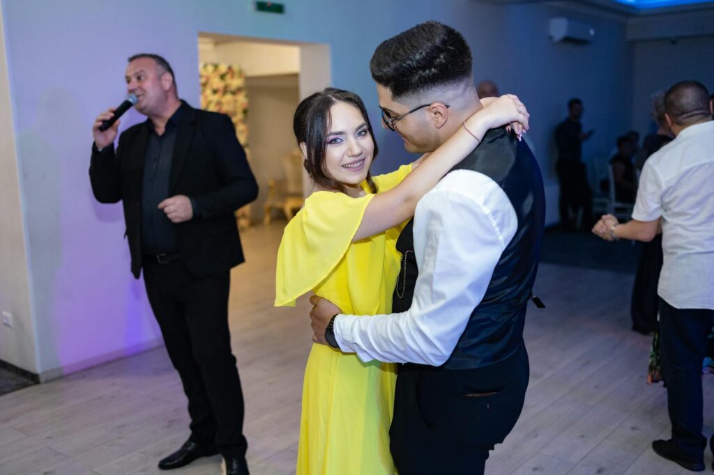 Couple discussing their music choices with a budget wedding DJ. — affordable wedding DJs Las Vegas