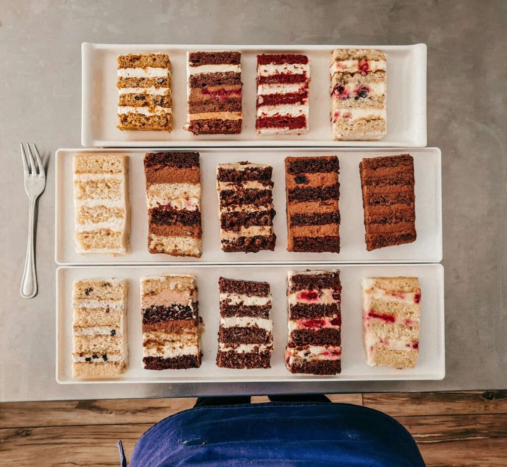 Couples tasting cake samples at a budget wedding bakery. — affordable wedding cakes Las Vegas