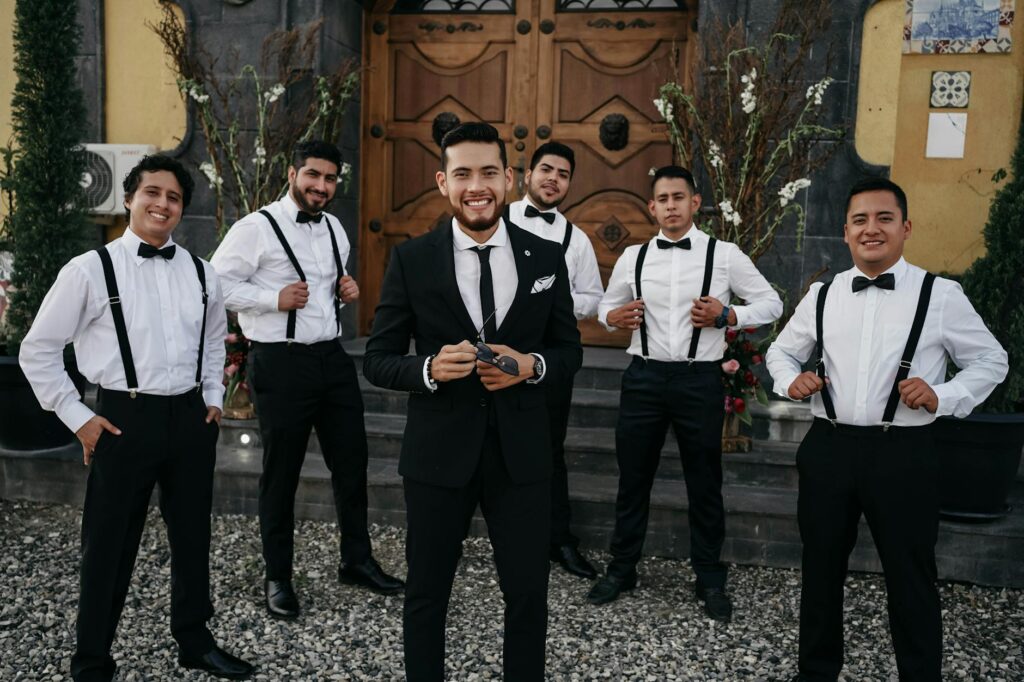 Groom and groomsmen in tailored suits, illustrating options for dressing at a casino wedding. — casino wedding dress code
