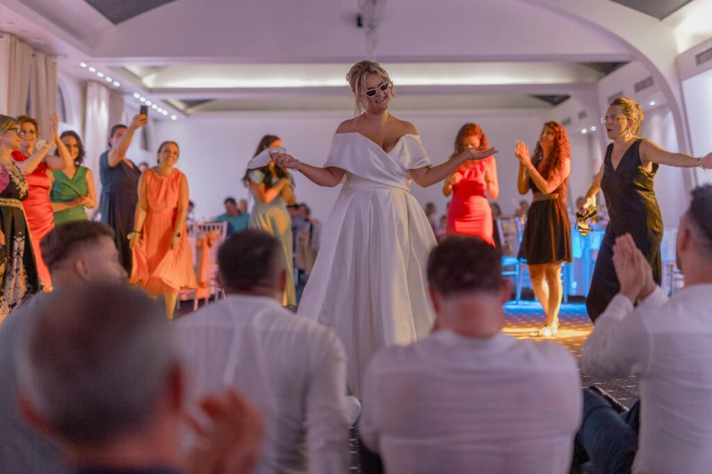Guests dancing joyfully on the sand during the reception. — beach wedding playlist Las Vegas