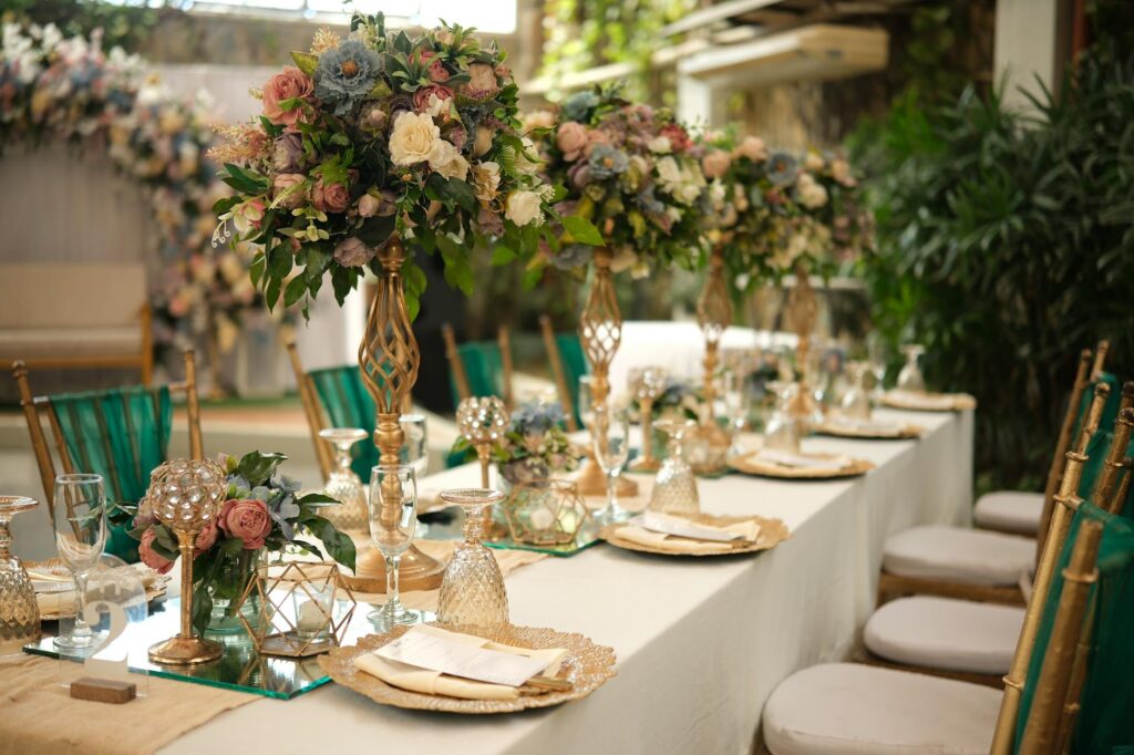 A beautifully decorated vintage-themed wedding reception in Las Vegas, featuring gold accents and elegant floral arrangeme…