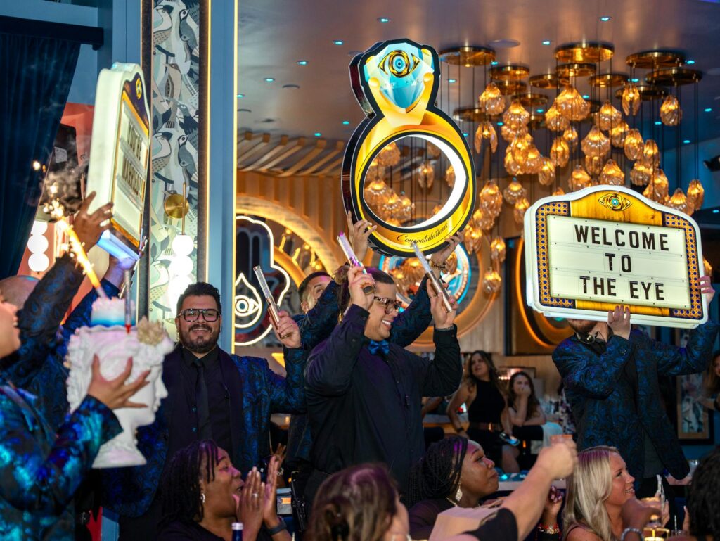 A candid shot of a couple celebrating with their guests in a chic Las Vegas venue. — Las Vegas wedding photography